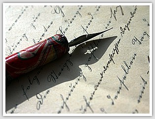 red calligraphy pen on parchment with neat handwriting