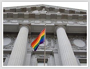 courthouse with gay flag in front