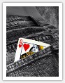 Queen of Hearts playing card in back pocket of jeans